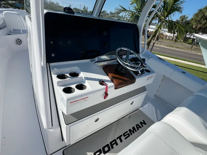  Yacht Photos Pics 2025 Sportsman 352 Open boat console with steering wheel and cup holders.