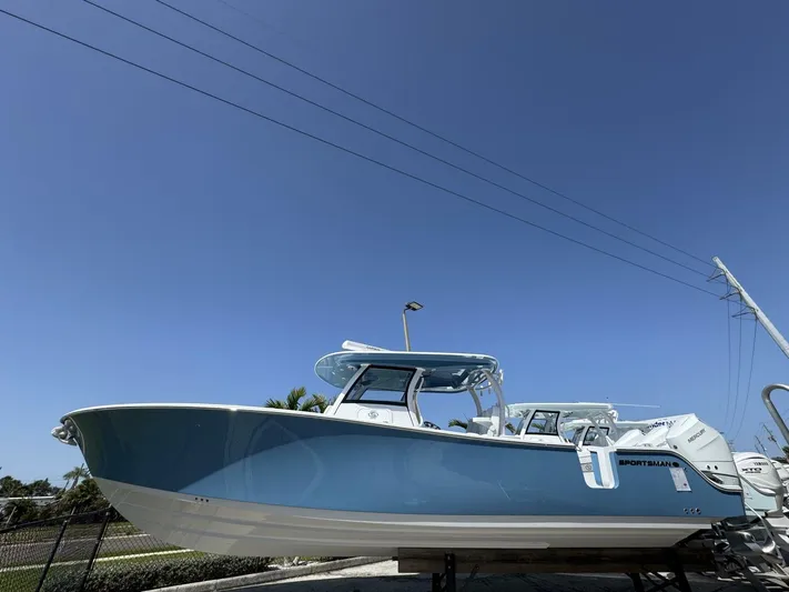  Yacht Photos Pics 2025 Sportsman 352 Open boat displayed outdoors under clear blue sky.