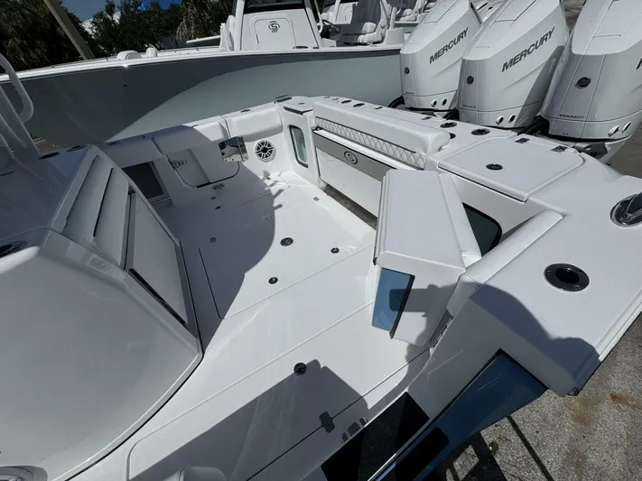  Yacht Photos Pics 2025 Sportsman 352 Open boat interior with Mercury engines, showcasing spacious deck and seating.
