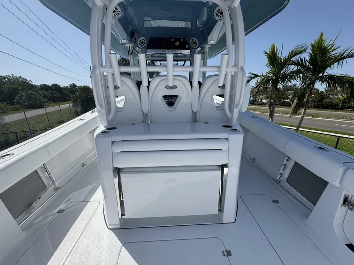  Yacht Photos Pics 2025 Sportsman 352 Open boat interior with seating and console, featuring sleek design and modern amenities.