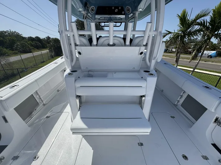  Yacht Photos Pics 2025 Sportsman 352 Open boat interior with seating and console, featuring sleek white design.