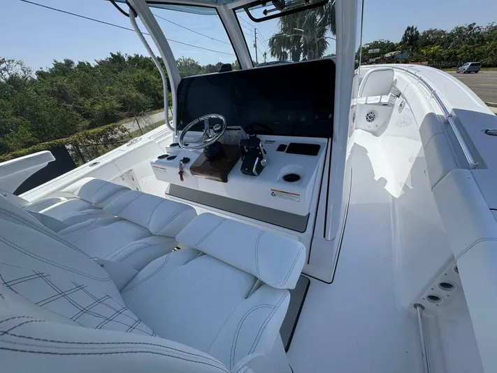  Yacht Photos Pics 2025 Sportsman 352 Open boat interior with sleek white seating and modern helm controls.