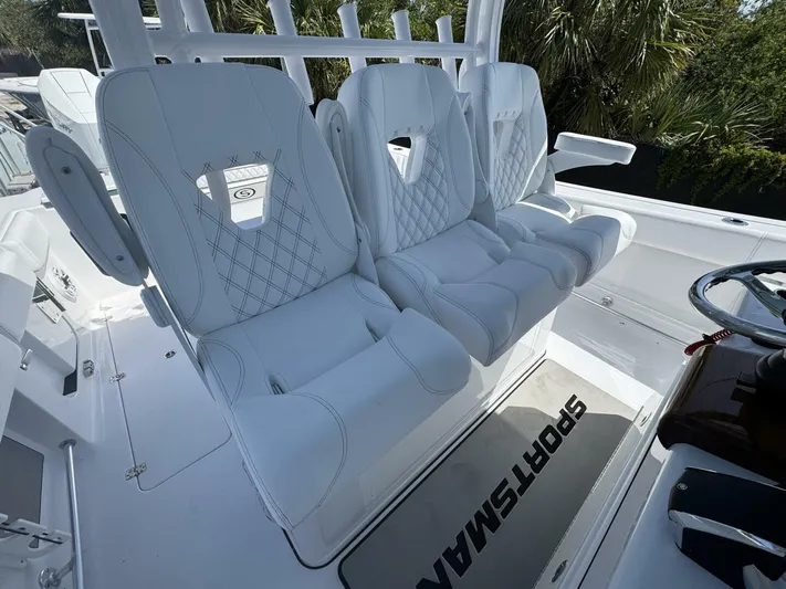  Yacht Photos Pics Luxury seating on 2025 Sportsman 352 Open boat, featuring white cushioned seats and sleek design.