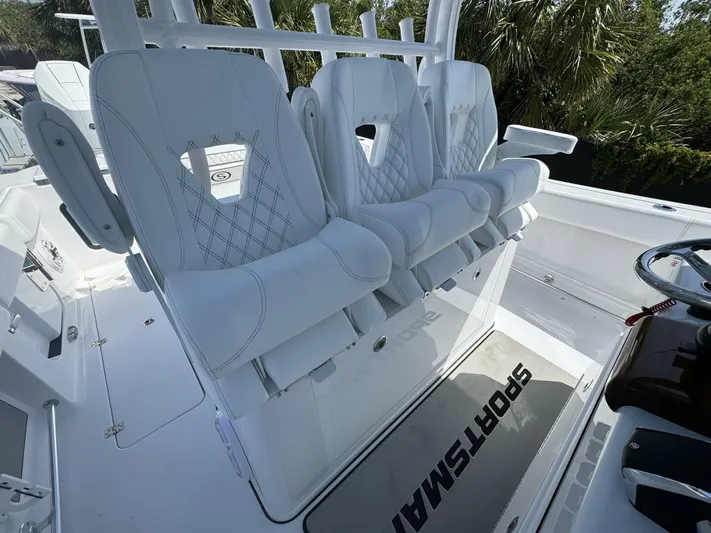  Yacht Photos Pics Luxury seating on 2025 Sportsman 352 Open boat, featuring white cushioned chairs.