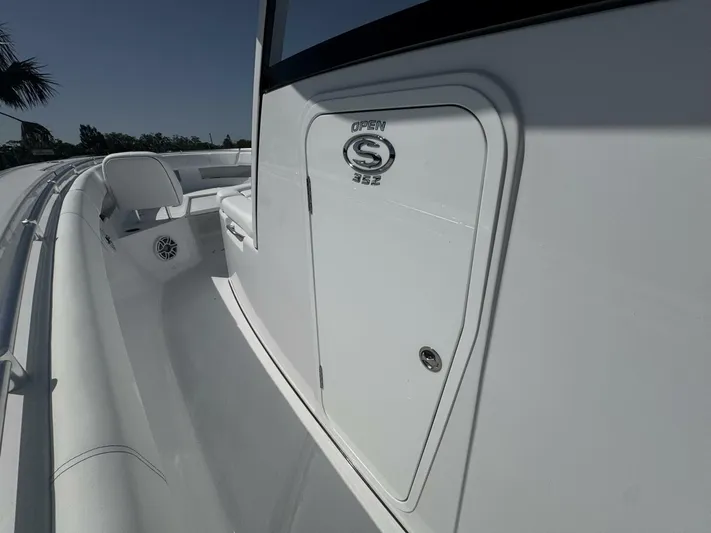  Yacht Photos Pics 2025 Sportsman 352 Open boat, sleek white design, side view with seating area.
