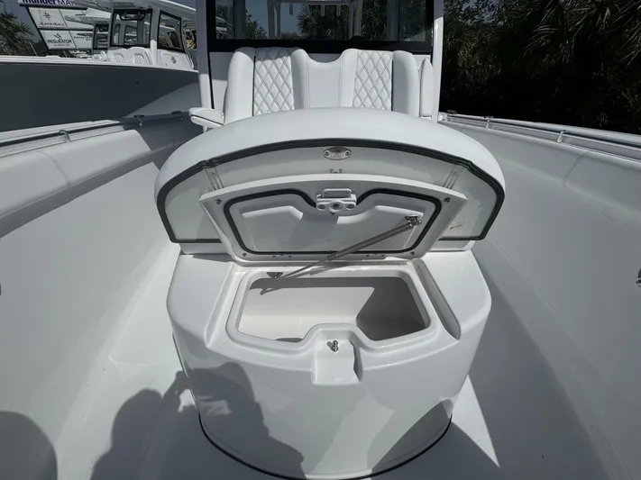  Yacht Photos Pics 2025 Sportsman 352 Open boat with open storage compartment, white seating, and sleek design.