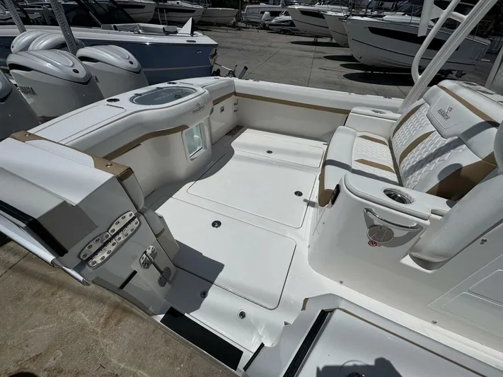  Yacht Photos Pics 2025 Regulator 35cc boat interior with seating and storage compartments.