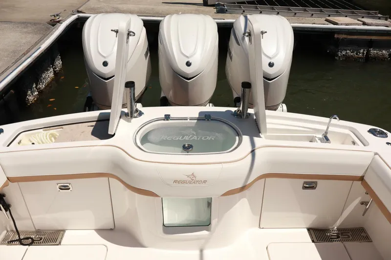  Yacht Photos Pics 2025 Regulator 35cc boat with triple outboard engines at dock.