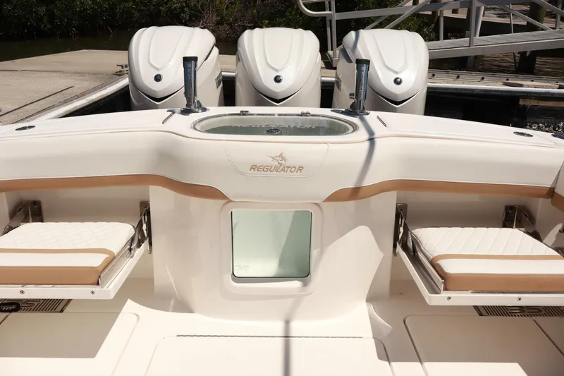  Yacht Photos Pics 2025 Regulator 35cc boat with triple engines and cushioned seating.