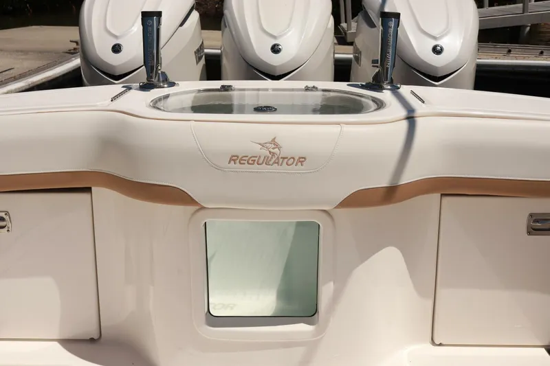  Yacht Photos Pics 2025 Regulator 35cc boat interior with logo and outboard motors.