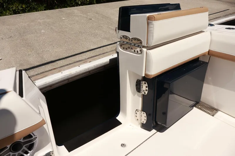  Yacht Photos Pics 2025 Regulator 35cc boat interior with cushioned seating and storage compartment.