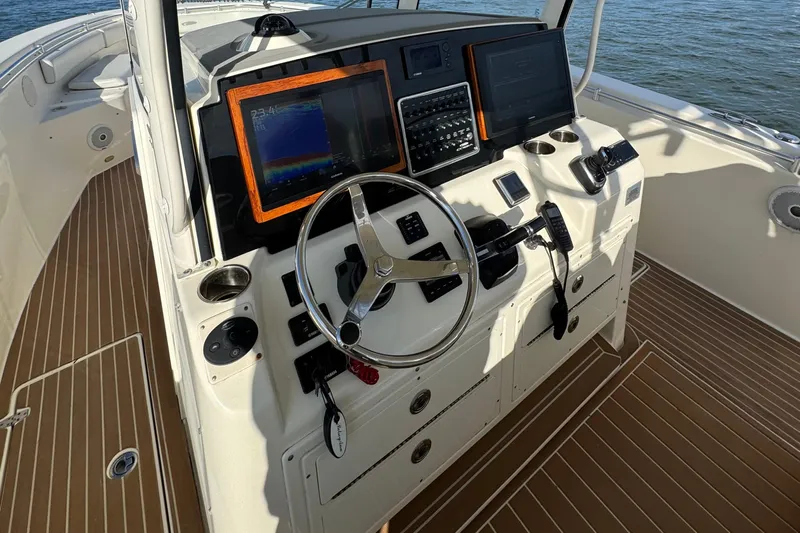 Betsey Ann Yacht Photos Pics 2015 Cobia 344 Center Console boat helm with modern navigation equipment.