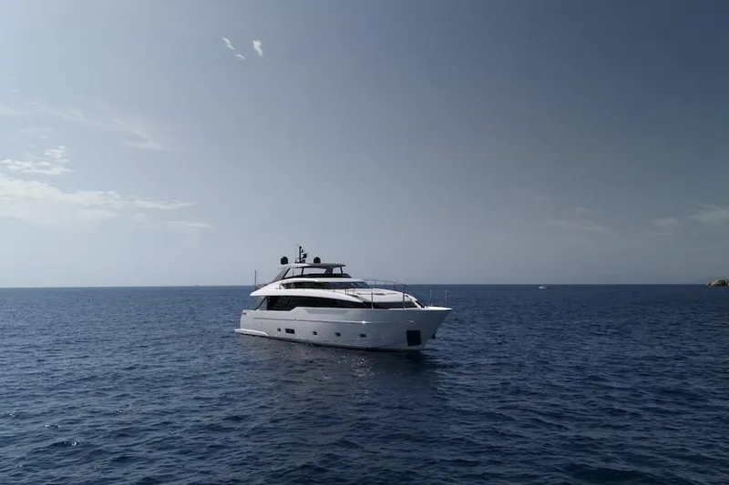  Yacht Photos Pics 2024 Sanlorenzo SL90A yacht cruising on open sea under clear sky.