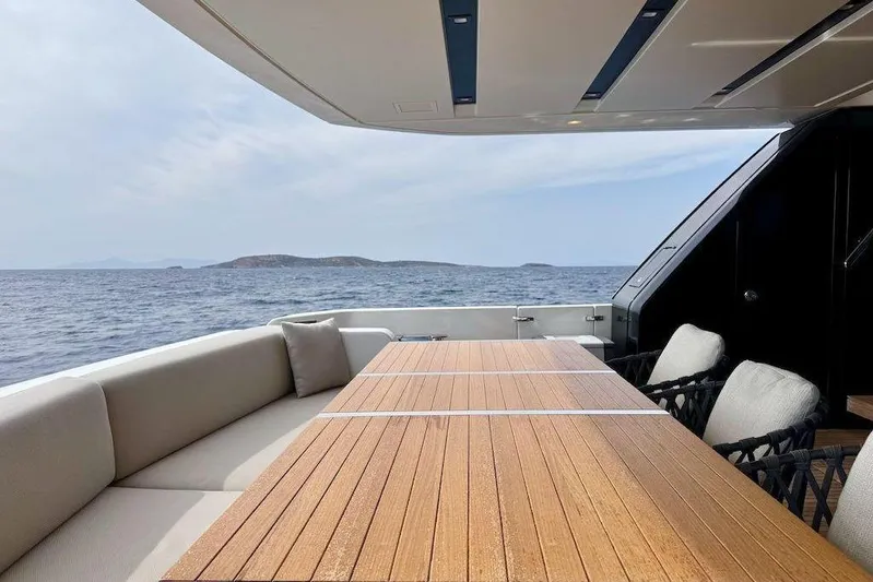  Yacht Photos Pics Luxurious 2024 Sanlorenzo SL90A yacht deck with elegant seating and ocean view.