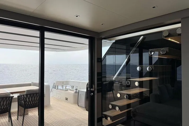  Yacht Photos Pics Luxurious 2024 Sanlorenzo SL90A yacht interior with ocean view and modern staircase.