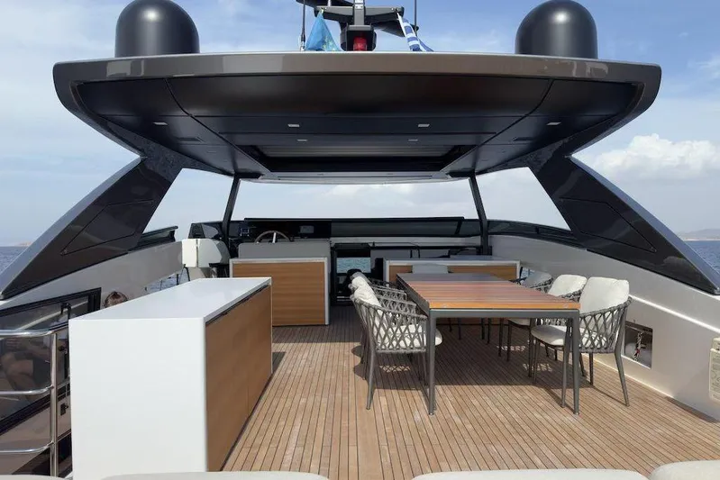  Yacht Photos Pics Luxurious 2024 Sanlorenzo SL90A yacht deck with modern dining area and sleek design.
