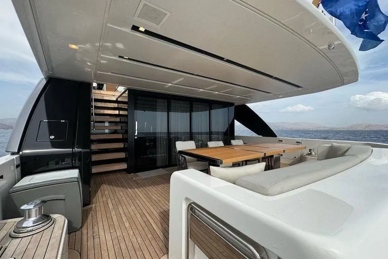  Yacht Photos Pics Luxurious 2024 Sanlorenzo SL90A yacht deck with elegant seating and dining area.