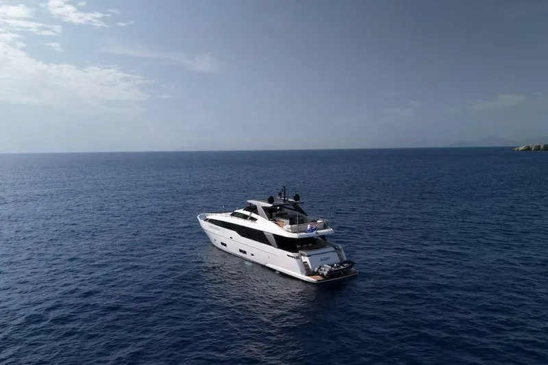  Yacht Photos Pics 2024 Sanlorenzo SL90A yacht cruising on open sea under clear sky.