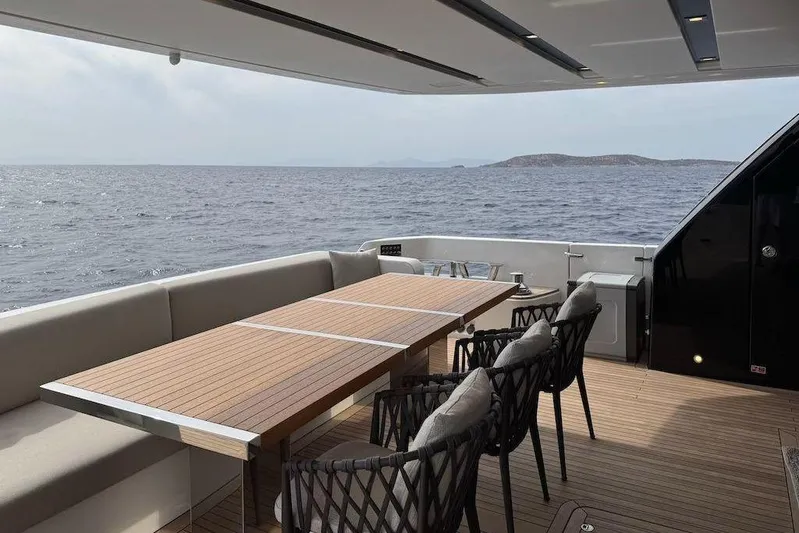  Yacht Photos Pics Luxury outdoor dining area on 2024 Sanlorenzo SL90A yacht with ocean view.