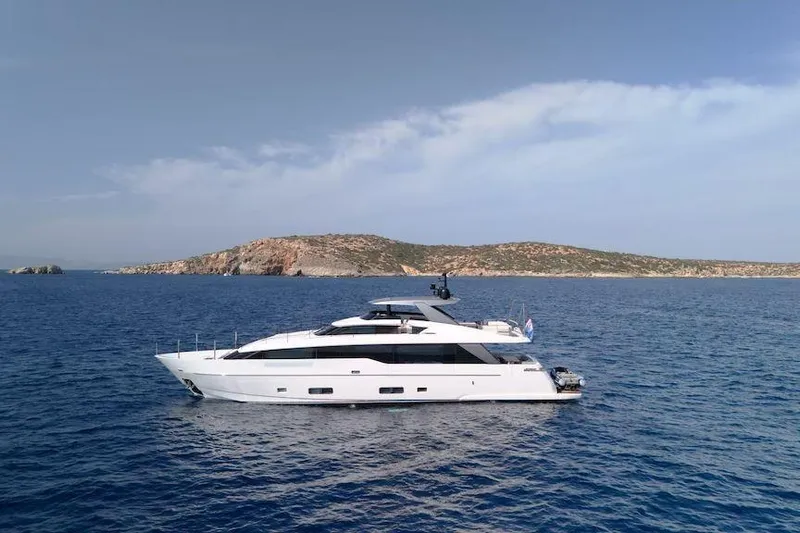  Yacht Photos Pics 2024 Sanlorenzo SL90A yacht cruising on open sea with scenic coastline backdrop.