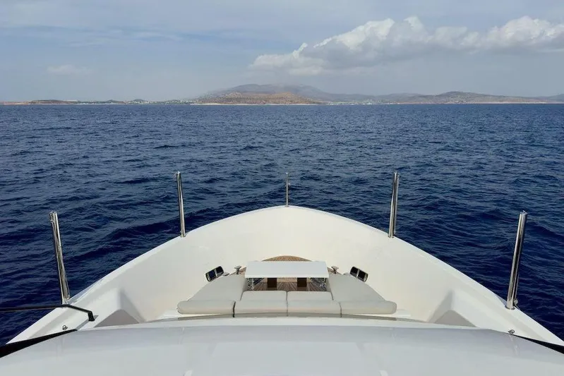  Yacht Photos Pics Sanlorenzo SL90A 2024 yacht cruising on open sea with distant land view.