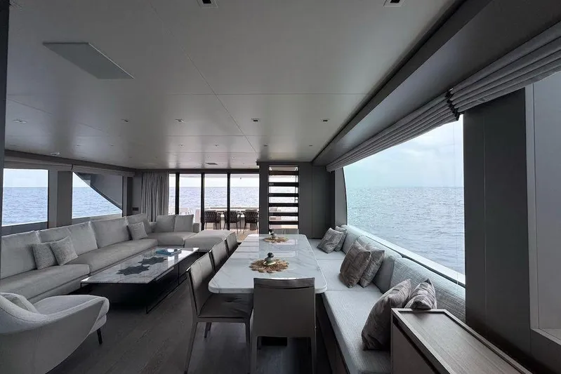  Yacht Photos Pics Luxurious interior of 2024 Sanlorenzo SL90A yacht with ocean view and elegant seating.