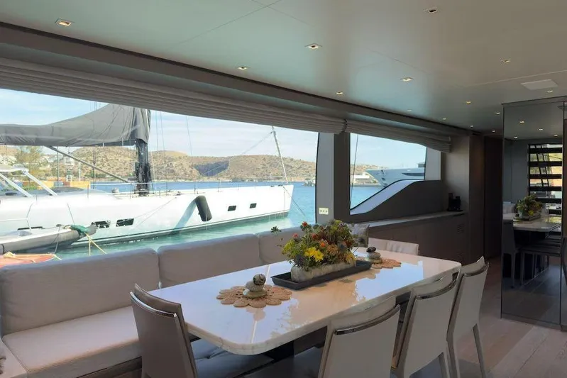  Yacht Photos Pics Luxurious interior of 2024 Sanlorenzo SL90A yacht with elegant dining area and scenic ocean view.