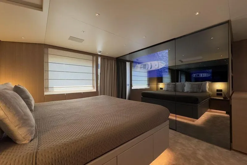  Yacht Photos Pics Luxurious bedroom interior of 2024 Sanlorenzo SL90A yacht with modern design and ambient lighting.