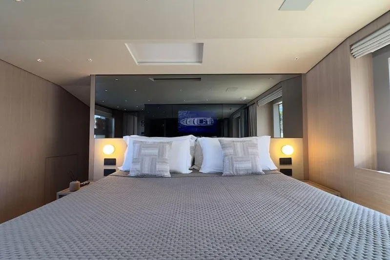  Yacht Photos Pics Luxurious bedroom interior of 2024 Sanlorenzo SL90A yacht with modern design and cozy bedding.
