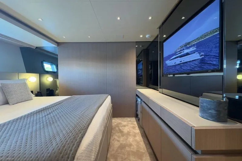  Yacht Photos Pics Luxurious bedroom interior of 2024 Sanlorenzo SL90A yacht with modern decor and large TV.