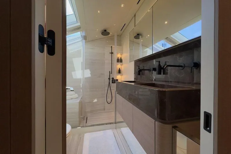  Yacht Photos Pics Luxurious bathroom in 2024 Sanlorenzo SL90A yacht with modern fixtures and elegant design.