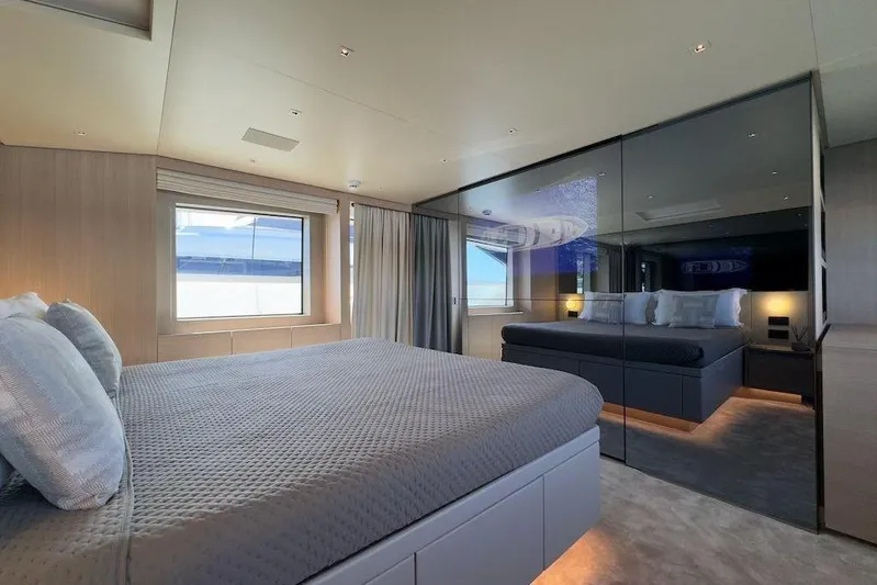  Yacht Photos Pics Luxurious bedroom interior of 2024 Sanlorenzo SL90A yacht with modern design and large window.