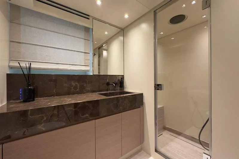  Yacht Photos Pics Luxurious bathroom in 2024 Sanlorenzo SL90A yacht with modern fixtures and elegant design.