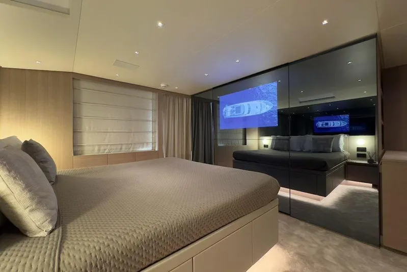 Yacht Photos Pics Luxurious bedroom interior of 2024 Sanlorenzo SL90A yacht with modern design and ambient lighting.