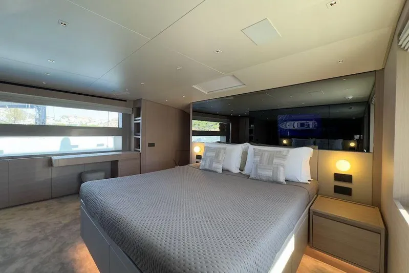  Yacht Photos Pics Luxurious bedroom interior of 2024 Sanlorenzo SL90A yacht with modern design and large windows.
