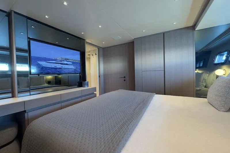  Yacht Photos Pics Luxurious bedroom interior of 2024 Sanlorenzo SL90A yacht with modern decor and TV.