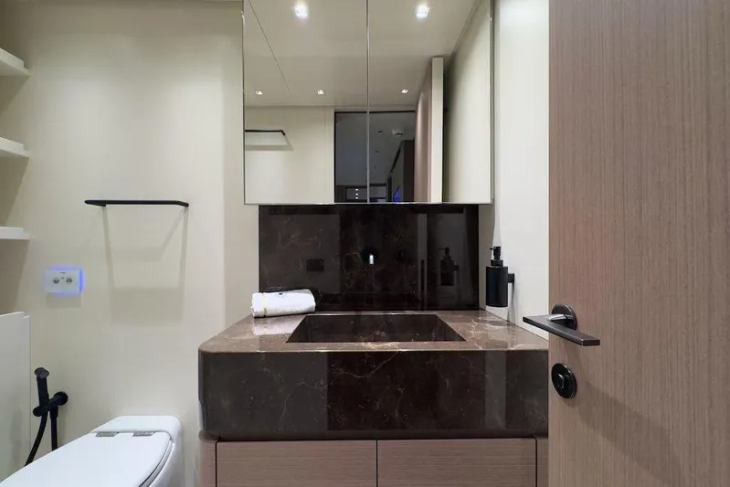  Yacht Photos Pics Luxurious bathroom in 2024 Sanlorenzo SL90A yacht with marble sink and modern fixtures.