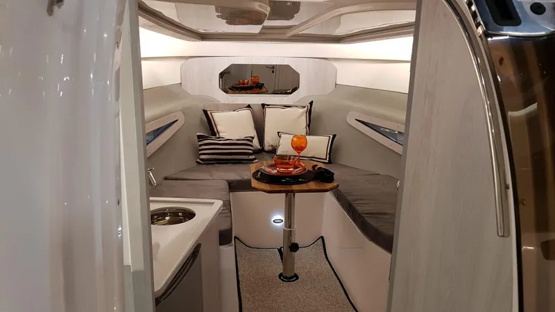 Custom Order Your 355 Today! Yacht Photos Pics Luxurious interior of 2025 Hanover 355 Outboard boat with cozy seating and elegant decor.