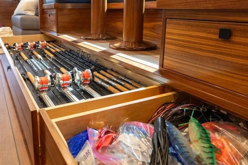 Boujie Yacht Photos Pics Fishing gear storage on 2025 Viking 82 Convertible yacht, featuring rods and tackle neatly organized.