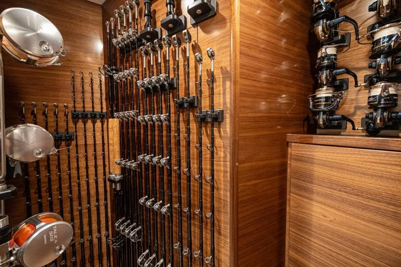 Boujie Yacht Photos Pics Fishing rod storage on 2025 Viking 82 Convertible yacht, featuring organized reels and rods.