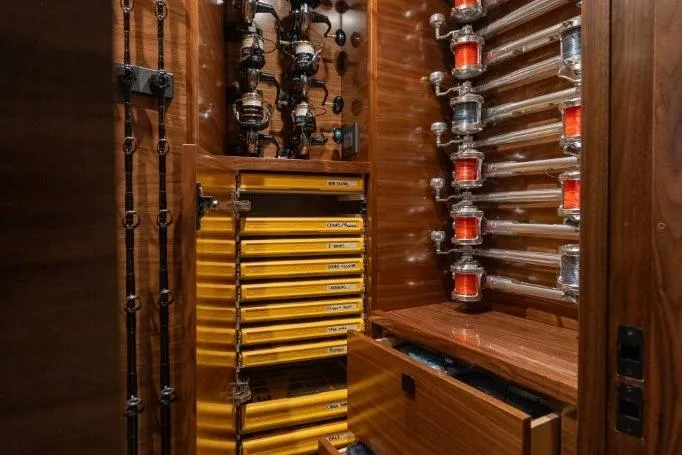 Boujie Yacht Photos Pics Fishing equipment storage on 2025 Viking 82 Convertible yacht, featuring rods, reels, and organized tackle drawers.