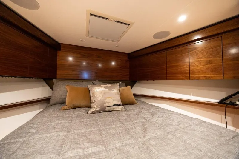 Boujie Yacht Photos Pics Luxurious cabin interior of 2025 Viking 82 Convertible yacht with elegant wood finish.