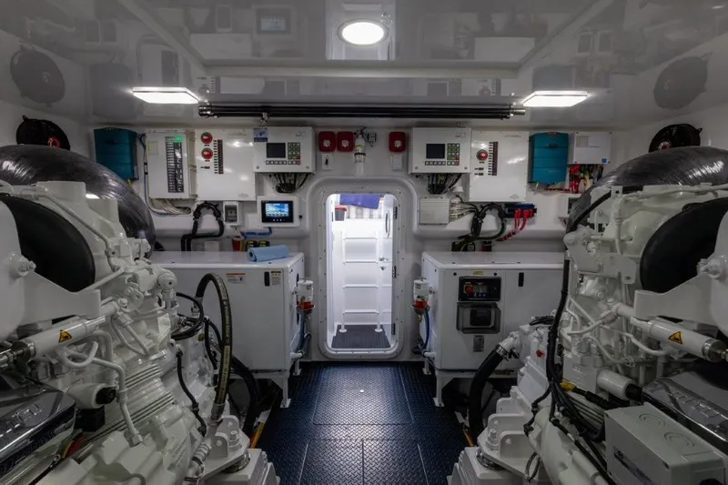 Boujie Yacht Photos Pics Engine room of 2025 Viking 82 Convertible yacht, featuring advanced machinery and control panels.