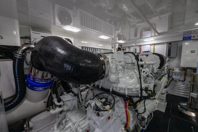 Boujie Yacht Photos Pics Engine room of 2025 Viking 82 Convertible yacht, showcasing advanced machinery and components.