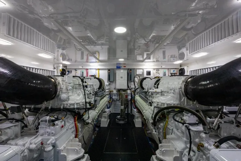 Boujie Yacht Photos Pics Engine room of 2025 Viking 82 Convertible yacht, featuring advanced machinery and sleek design.