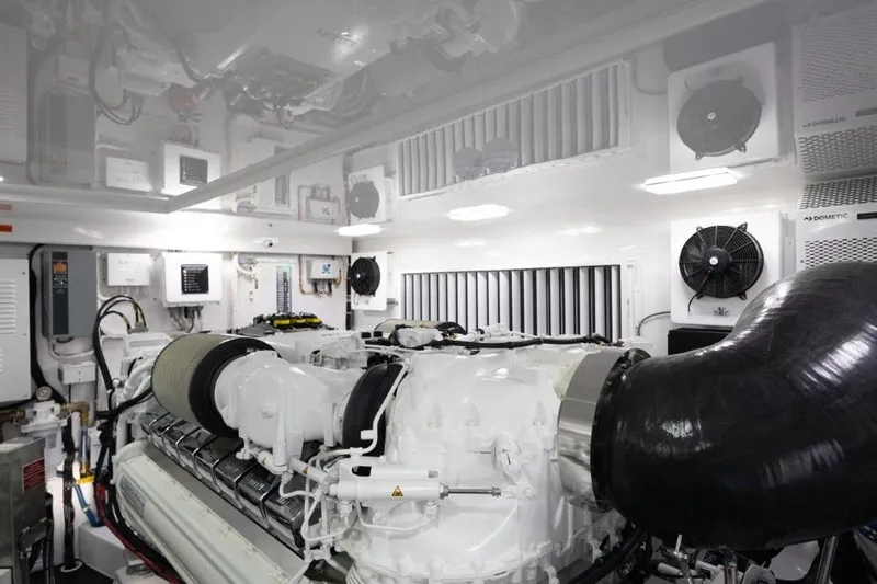 Boujie Yacht Photos Pics Engine room of 2025 Viking 82 Convertible yacht, featuring advanced machinery and ventilation systems.