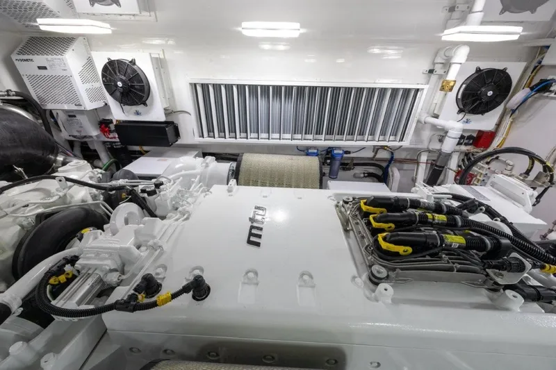 Boujie Yacht Photos Pics Engine room of 2025 Viking 82 Convertible yacht, showcasing advanced machinery and components.