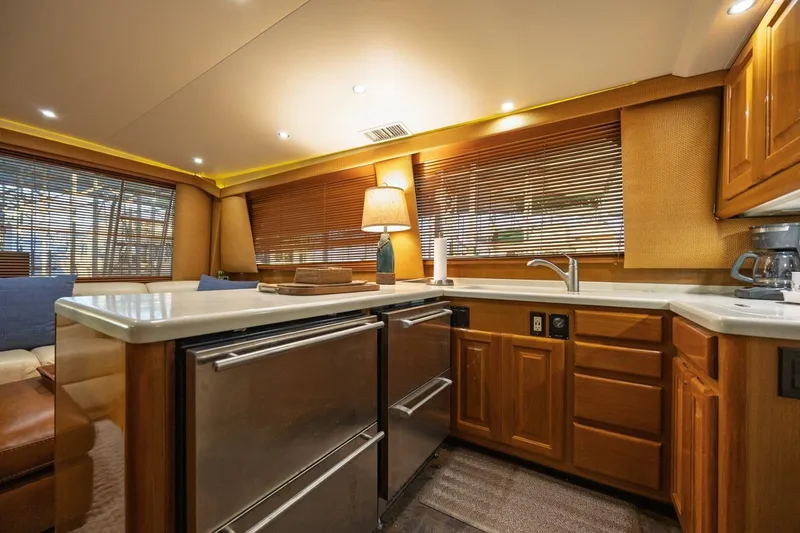 Miss Scarlett Yacht Photos Pics Luxurious kitchen interior of 1998 Viking 50 Convertible yacht with modern amenities.