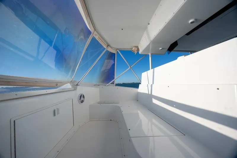 Miss Scarlett Yacht Photos Pics Interior view of a 1998 Viking 50 Convertible yacht with blue-tinted windows.