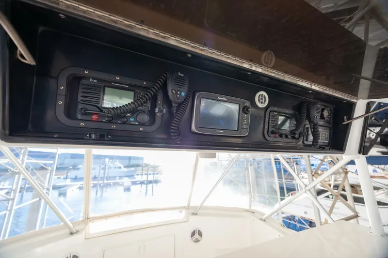 Miss Scarlett Yacht Photos Pics Control panel of a 1998 Viking 50 Convertible yacht with navigation equipment.